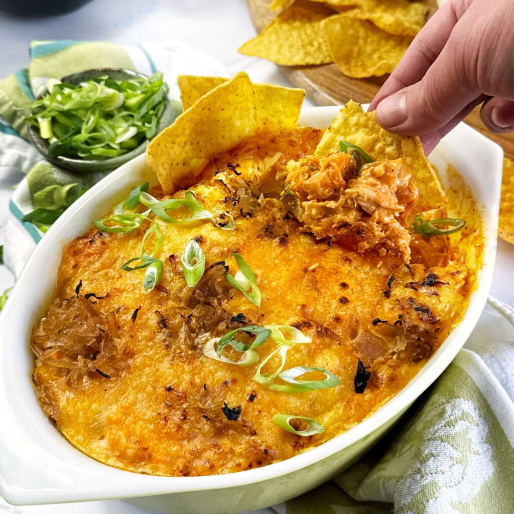 A small white casserole dish with BBQ Buffalo Chick Dip