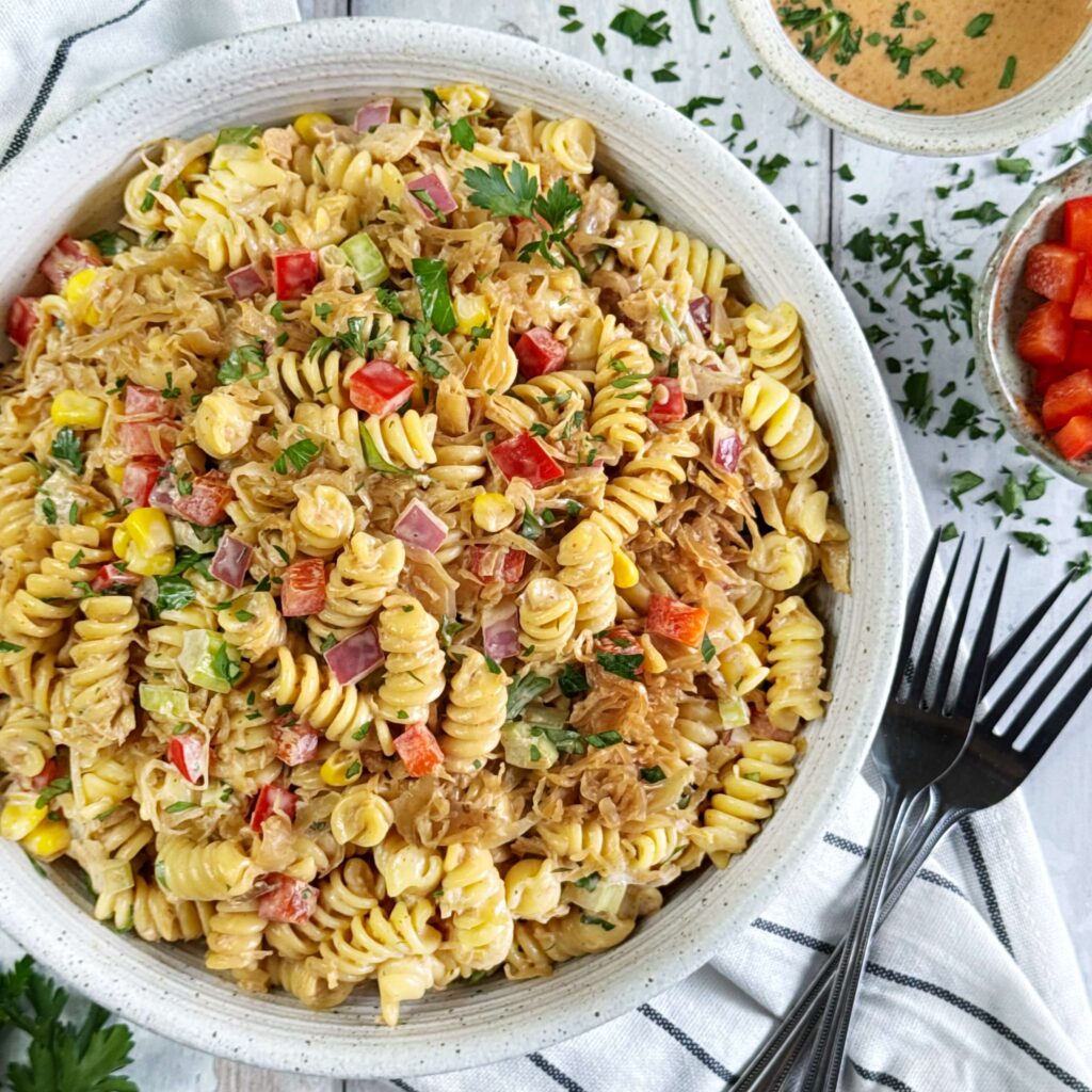 A white bowl with BBQ Krata Pasta salad.