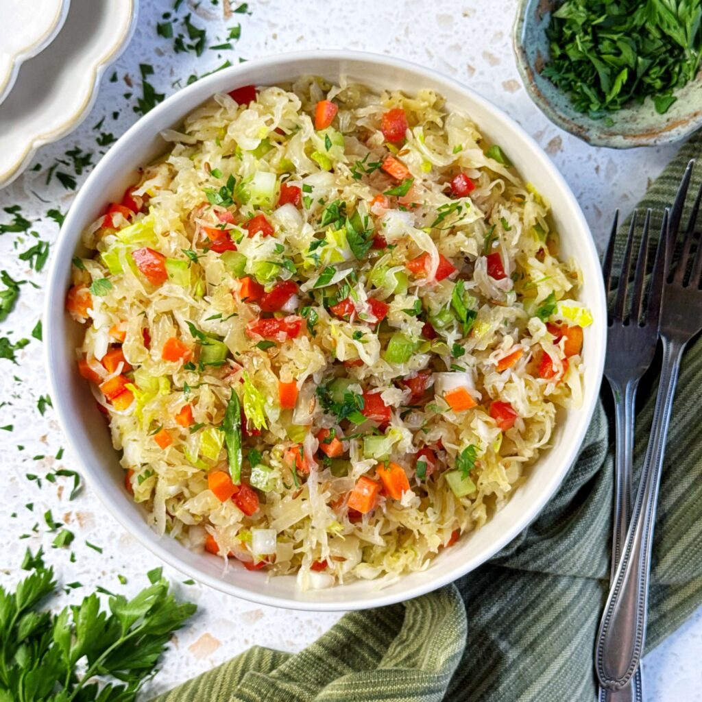 Big white bowl of Sweet and Sour Bavarian Kraut Salad