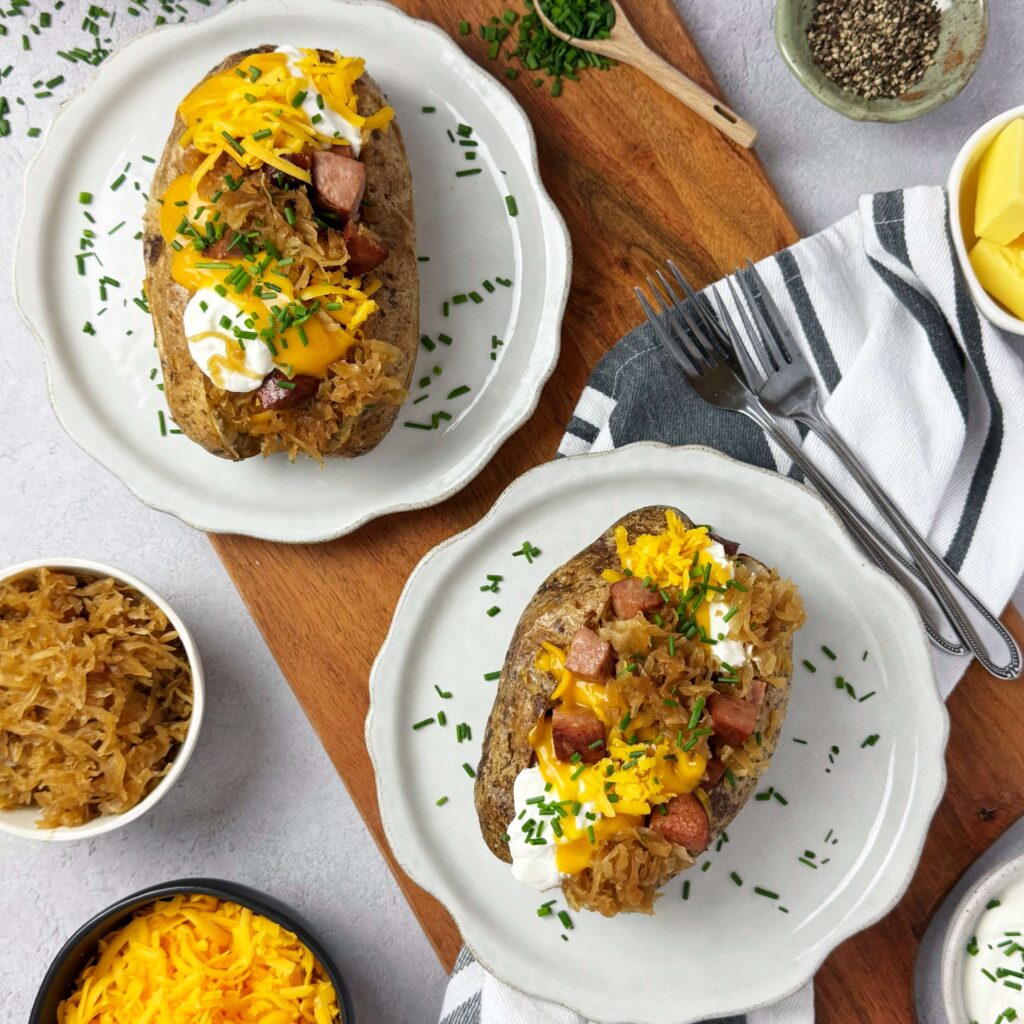 Loaded Baked potato with BBQ Kraut and Kielbasa.