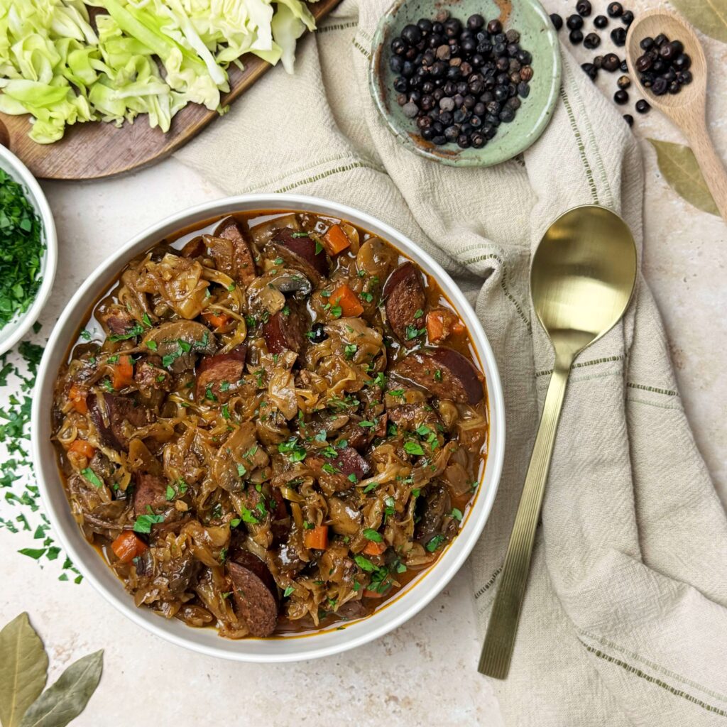 A white dinner bowl of Traditional Polish Hunters Stew