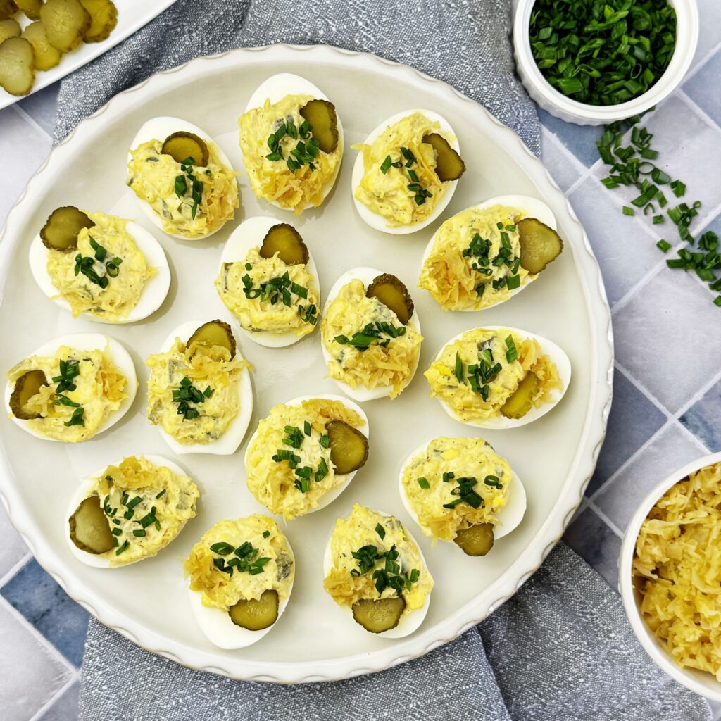 A dinner plater with Mustard Kraut and Pickle Deviled Eggs